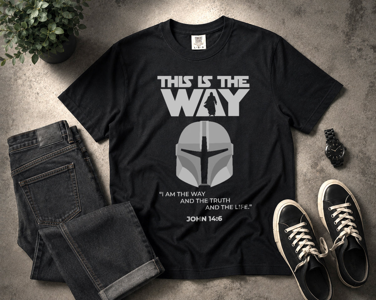 Black This Is the Way Christian graphic T-shirt with Mandalorian-inspired helmet and John 14:6 design shown in a flat lay