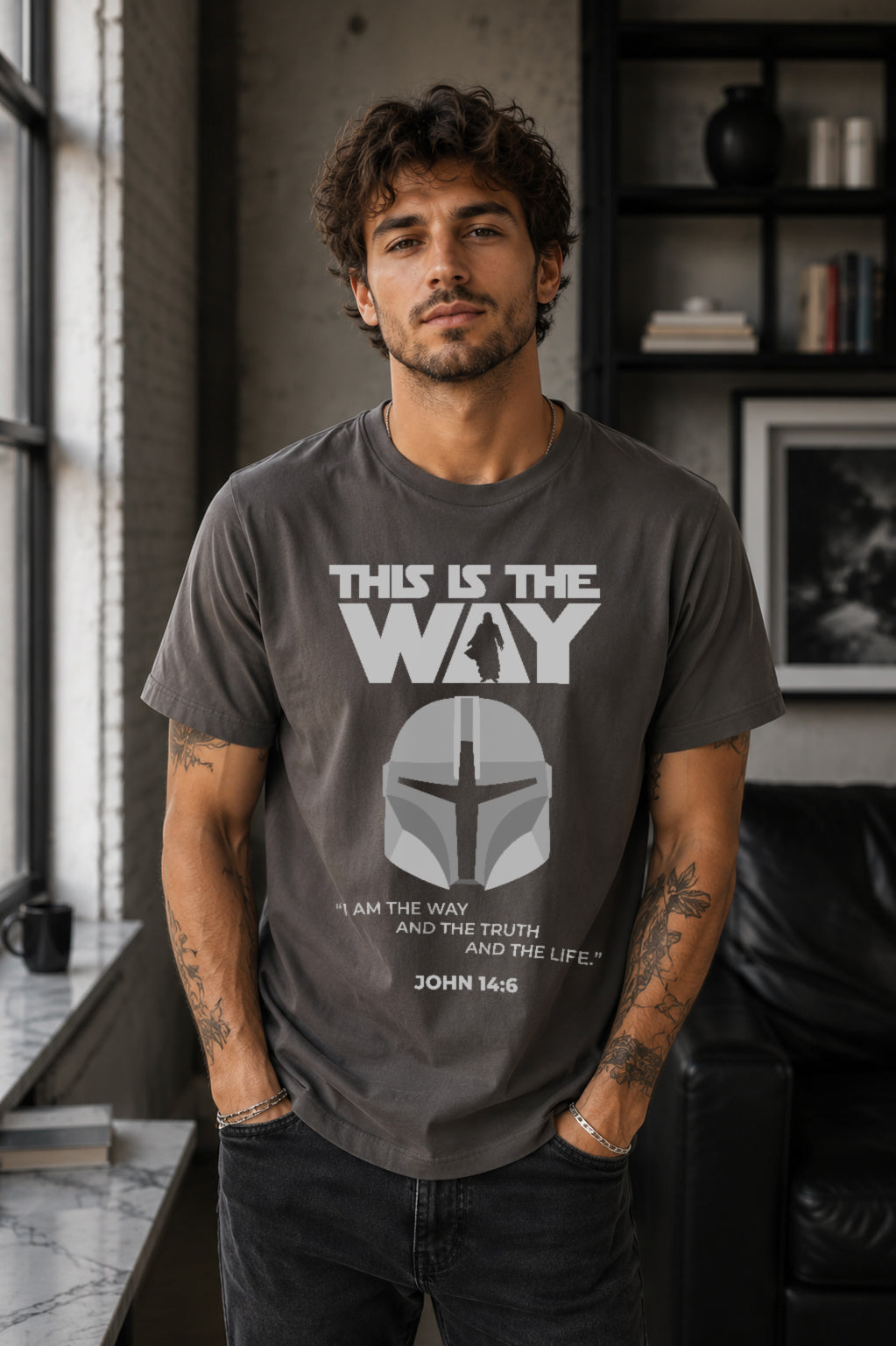 Man wearing a pepper gray This Is the Way Christian graphic T-shirt featuring a Mandalorian-inspired helmet and John 14:6 design