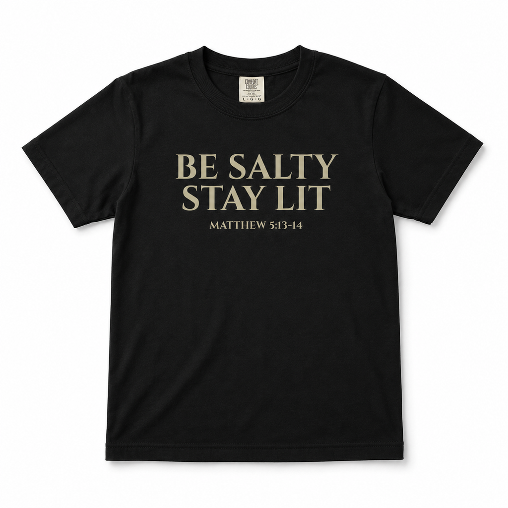 Black “Be Salty Stay Lit” youth Christian t-shirt featuring Matthew 5:13–14 in a clean front-facing product mockup.