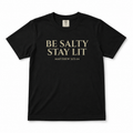 Black “Be Salty Stay Lit” youth Christian t-shirt featuring Matthew 5:13–14 in a clean front-facing product mockup.
