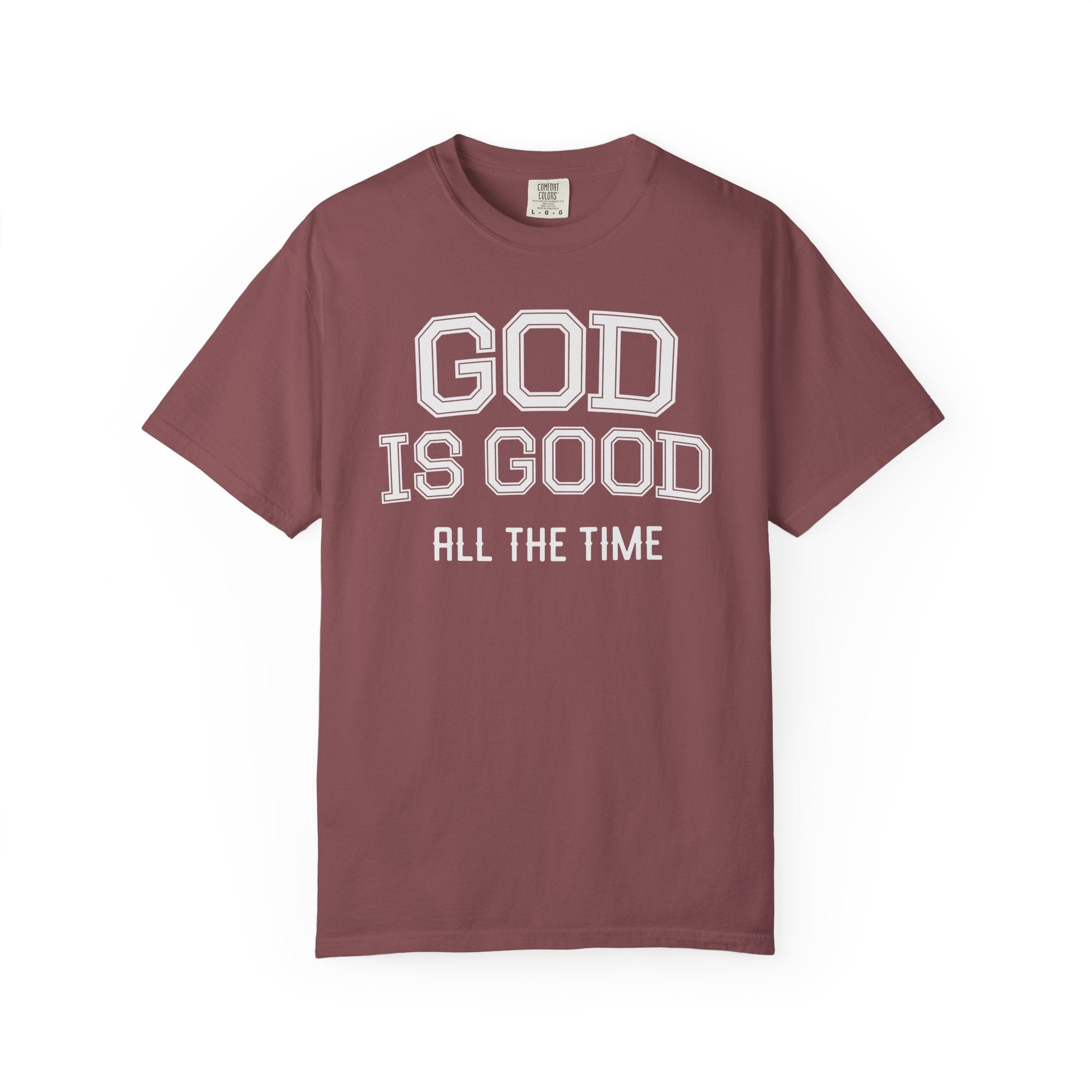 Brick-colored Christian t-shirt featuring “God Is Good All The Time” varsity-style text design