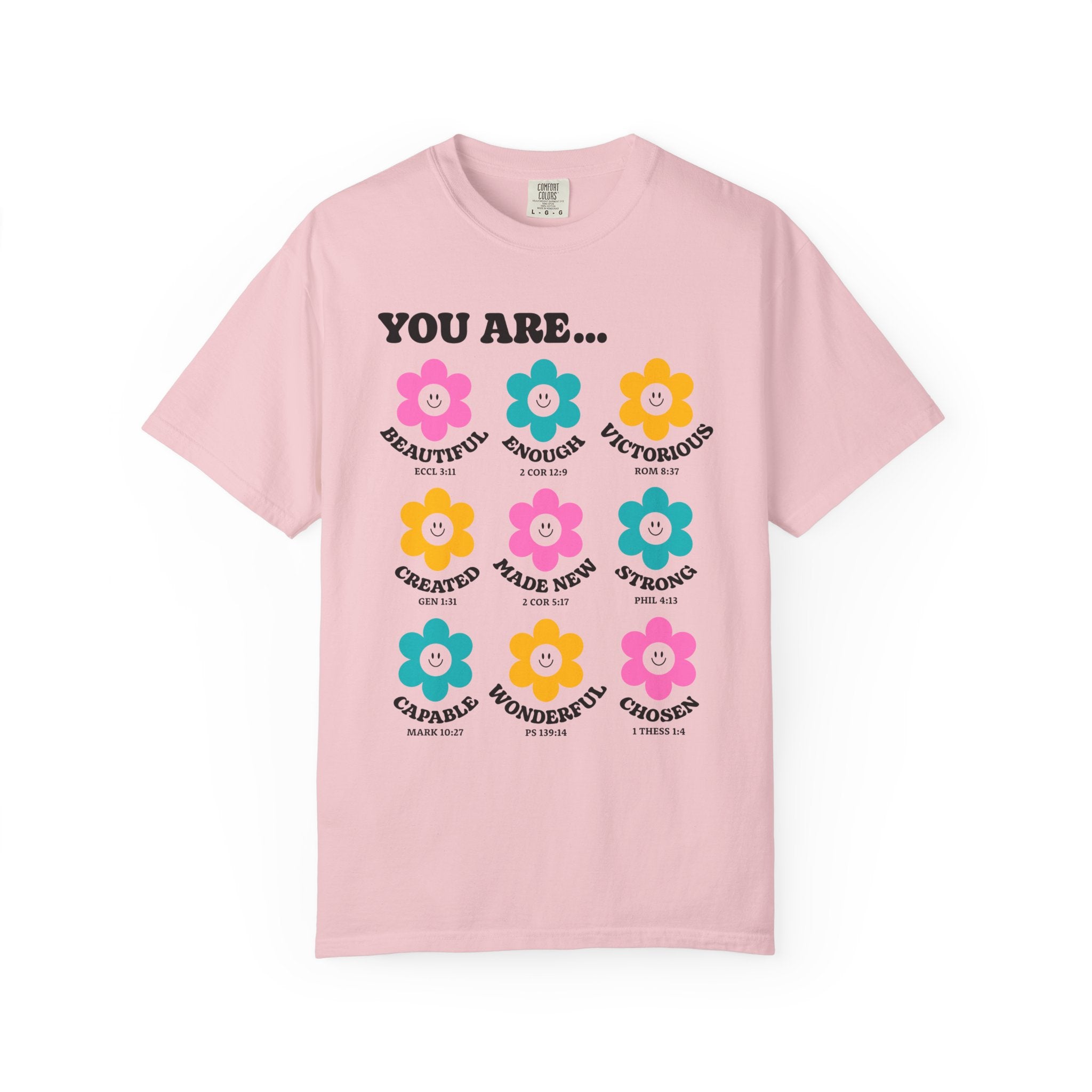 Blossom pink Christian t-shirt with colorful retro flower graphic and faith-inspired affirmations including “Chosen,” “Wonderful,” and “Made New”