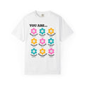 White Christian t-shirt with colorful retro flower design featuring uplifting Bible-based affirmations including “Beautiful,” “Enough,” and “Strong”